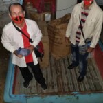 Pastor and deacon receiving items sent to Iglesia Bautista Valle Cristiano Camaguey, Cuba.